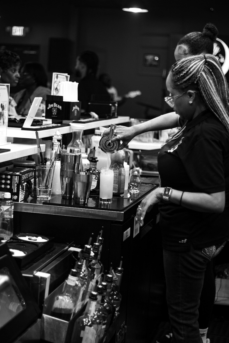 A bartender mid-pour — atmosphere in the making