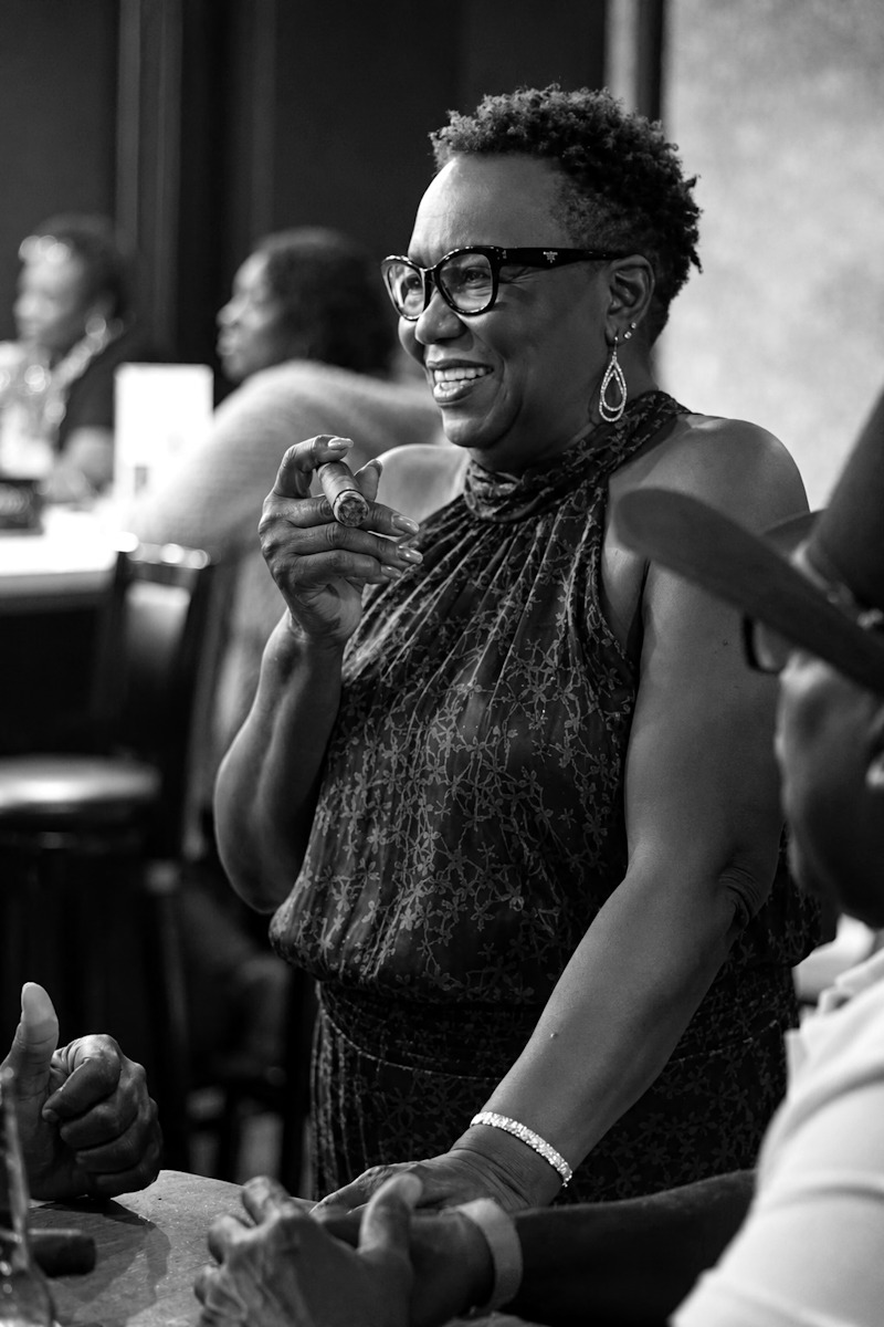 Dirty Shirley's — the host with a cigar, black and white